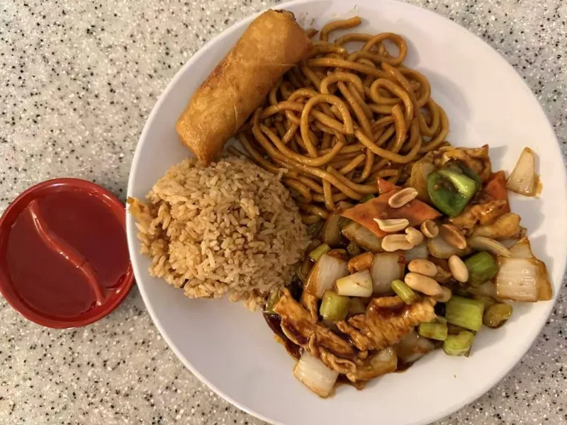 Dinner combo: cashew chicken, noodles, fried rice, egg roll at China Dragon, a Chinese Restaurant in Orange Beach