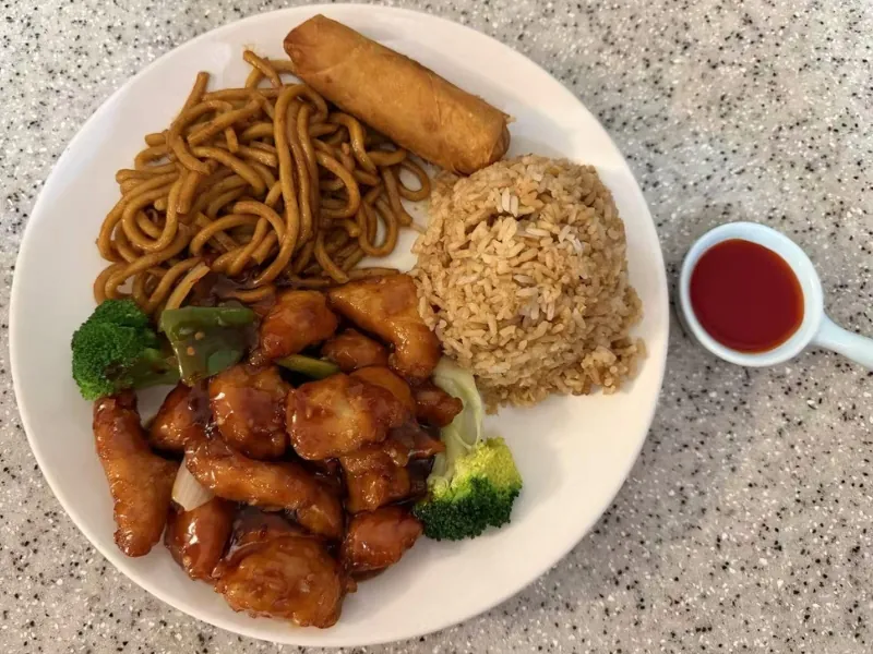 Dinner combo: General Tso’s chicken, noodles, fried rice, egg roll at China Dragon, a Chinese Restaurant in Orange Beach